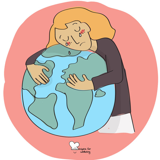 Person hugging the earth, managing eco-anxiety