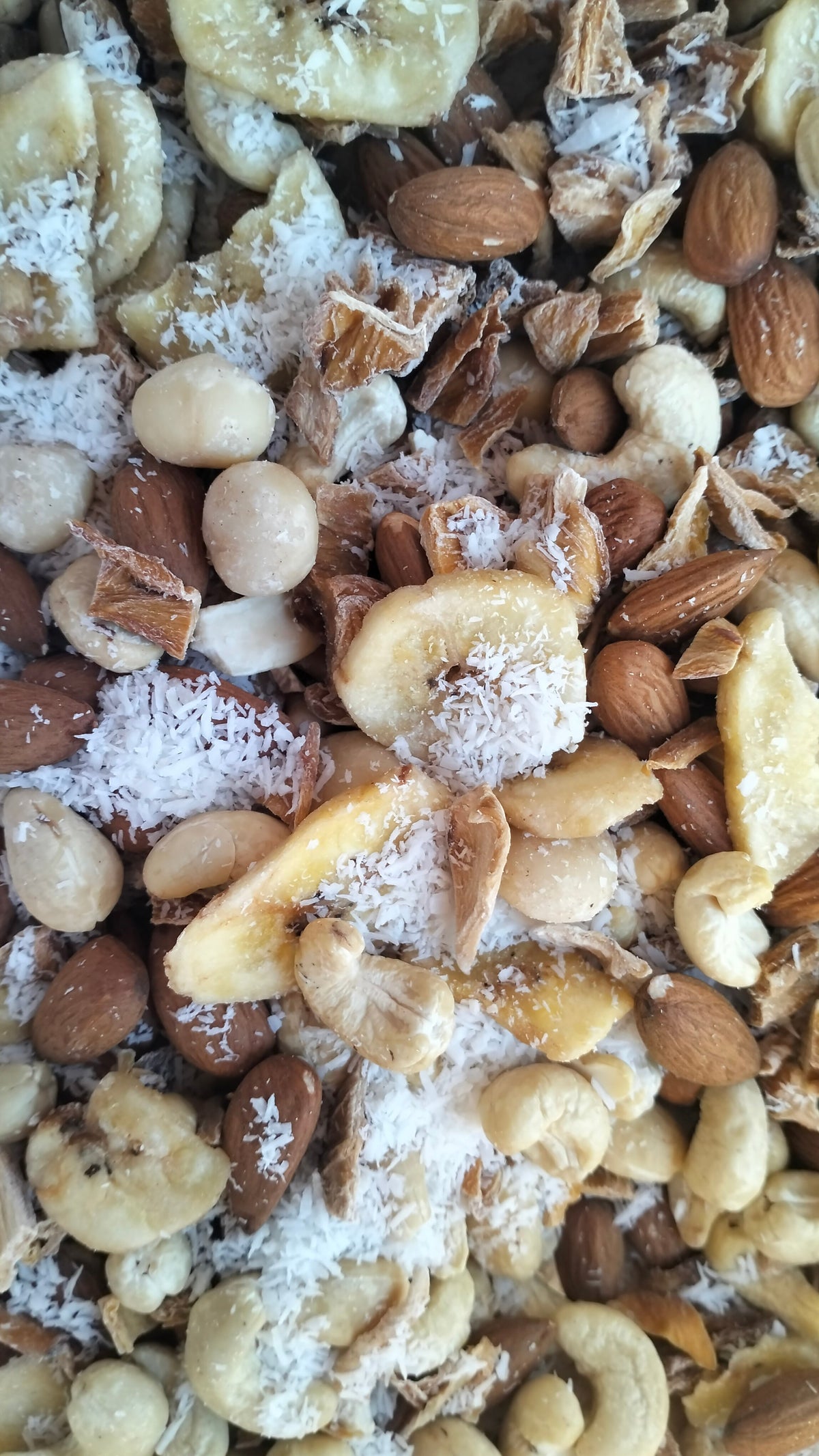 Tropical Nut Mix of macadamias, cashews, almonds, dried mango, banana chips and coconut